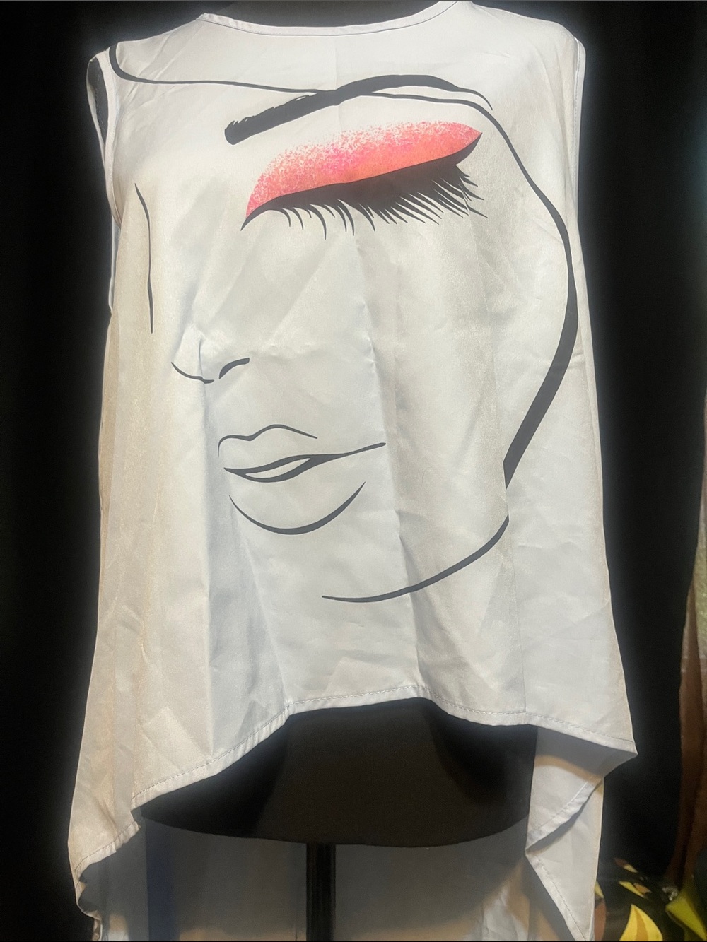 Light Blue Sleeveless Face Graphic High-Low Top with Pink Accent